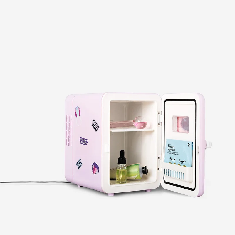 Purple mini cosmetics fridge with stickers