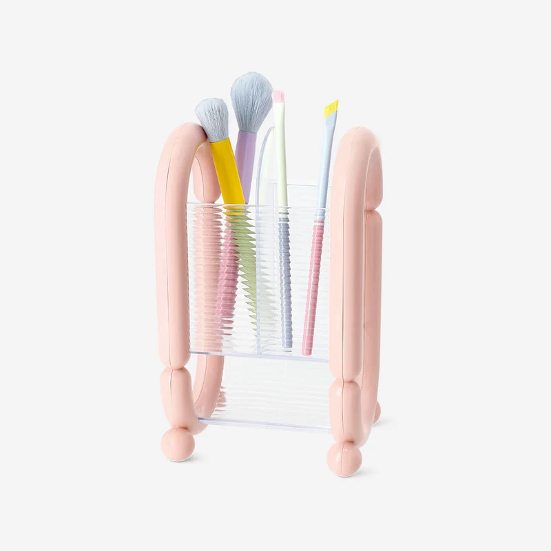Pink cosmetic organiser for makeup brushes